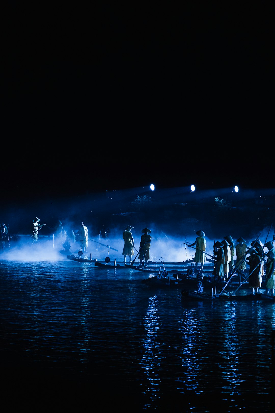 people on a boat watching a fireworks display