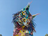 Close-up of a colorful sculpture made from recycled metal scraps.