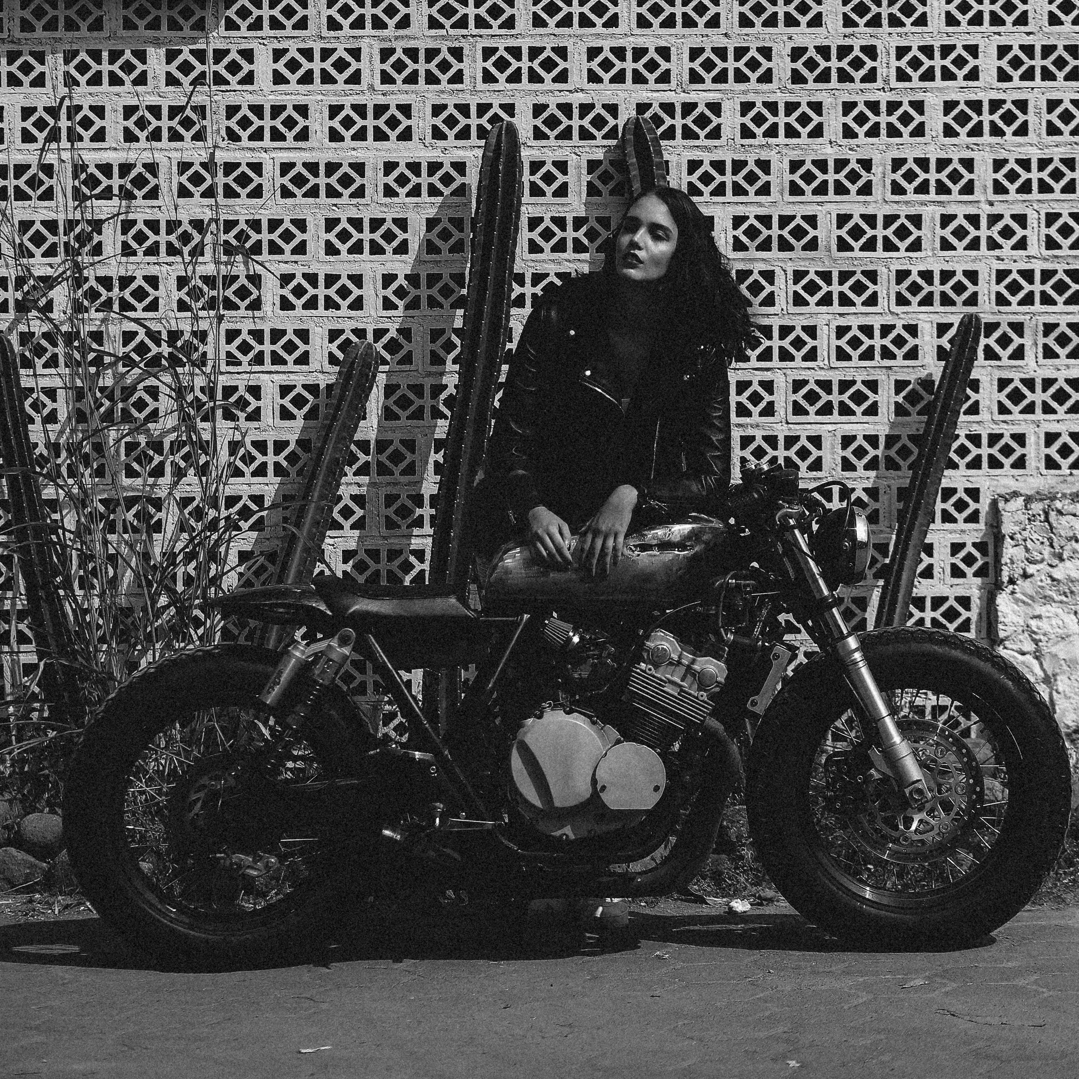 woman in black jacket riding motorcycle