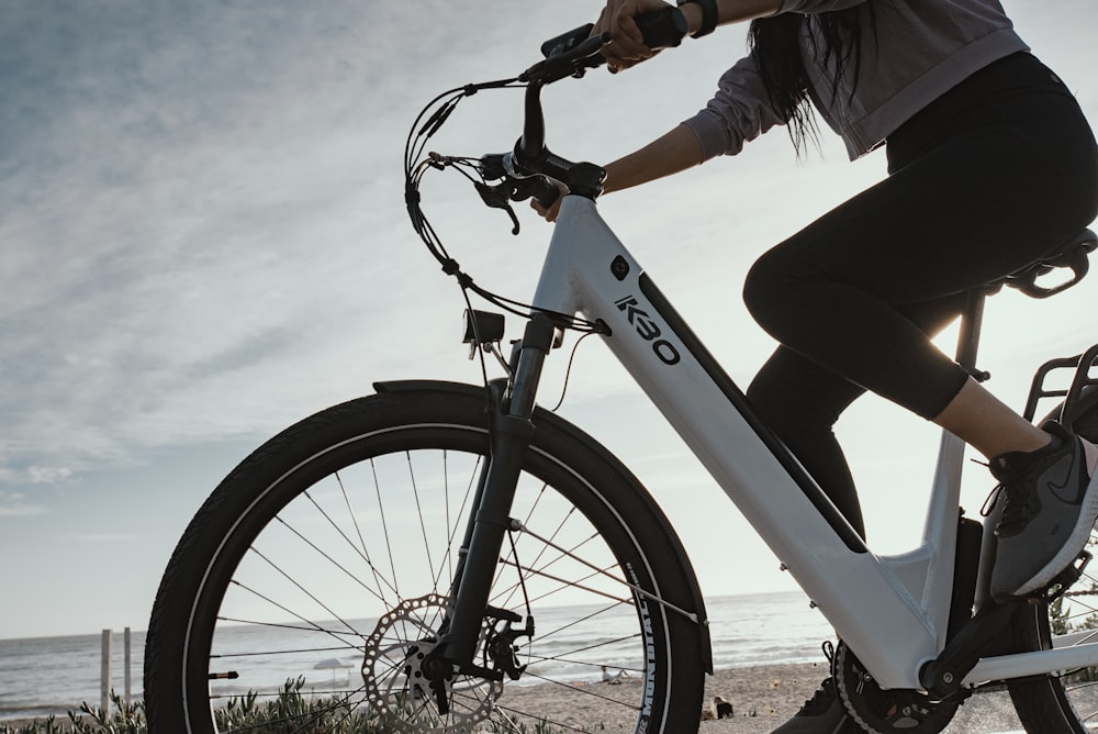 person riding white and black bicycle