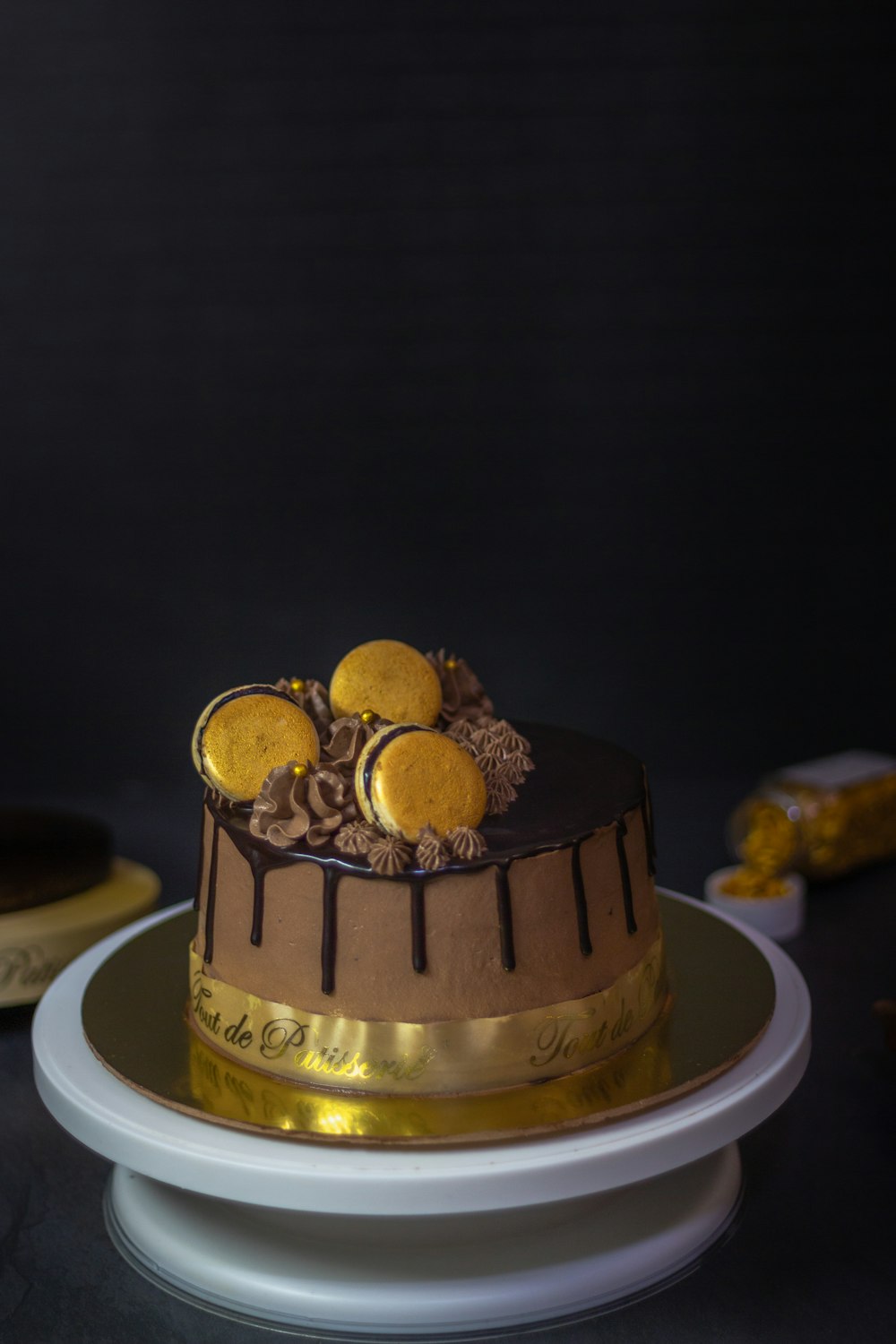 gold round cake on white ceramic plate