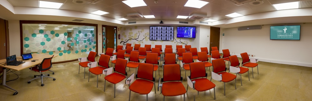 red chairs inside white room