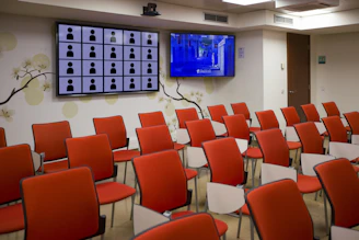 black flat screen tv mounted on white wall