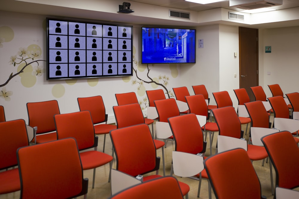 black flat screen tv mounted on white wall