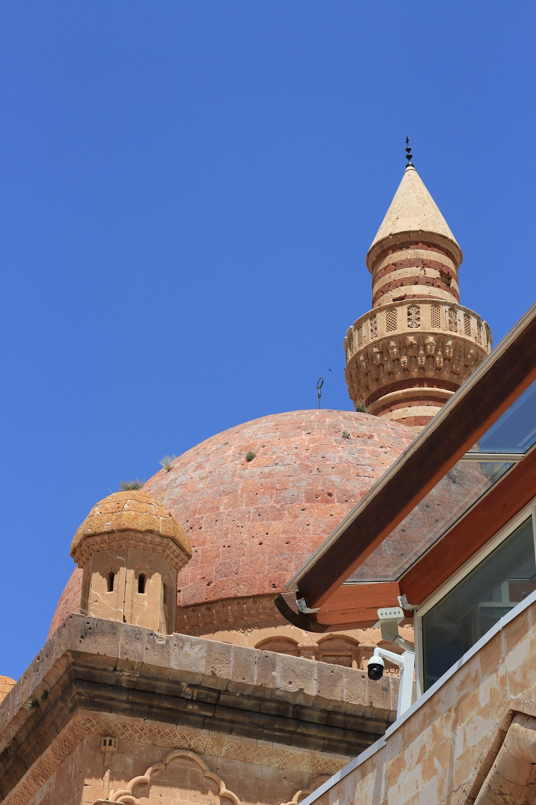 brown concrete building under blue sky during daytime