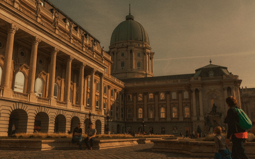 people walking near brown concrete building during daytime