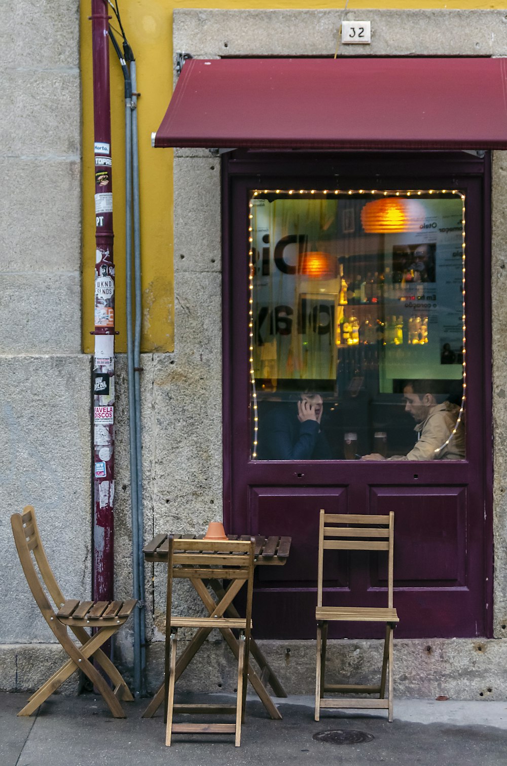 brown wooden chair beside brown wooden door