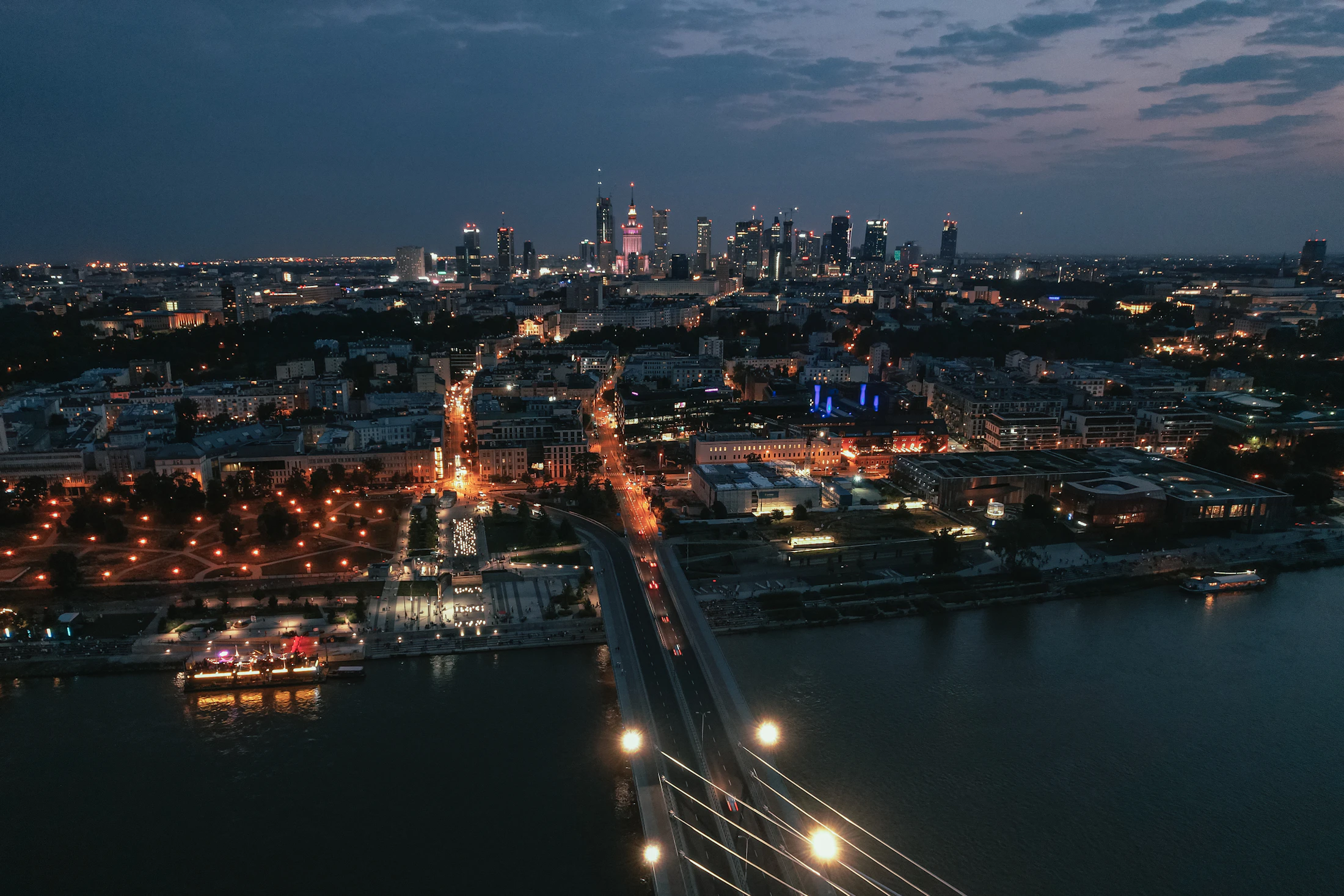 Warsaw skyline at night with the Palace of Culture and Science lit