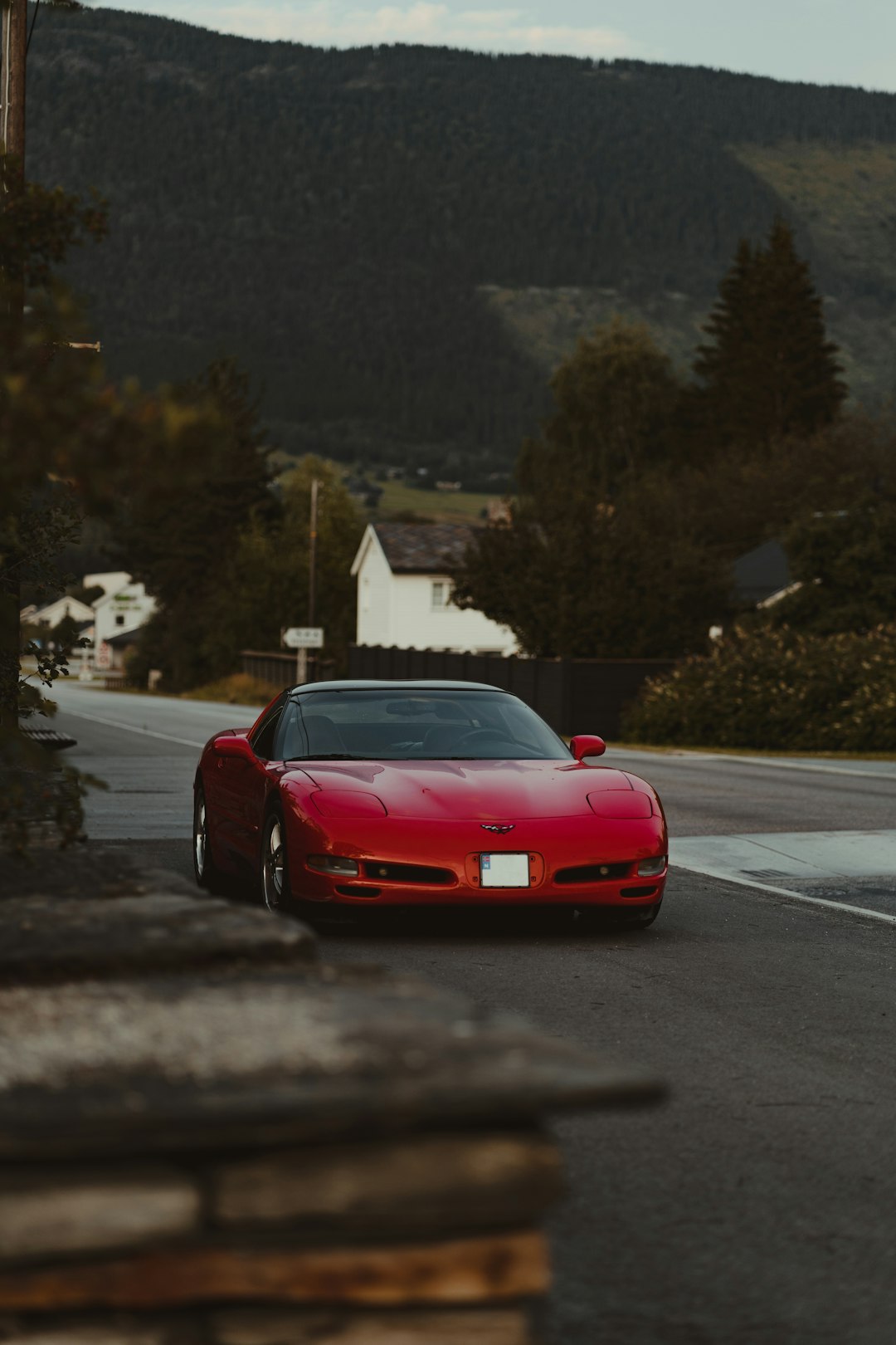 red ferrari sports car on road during daytime