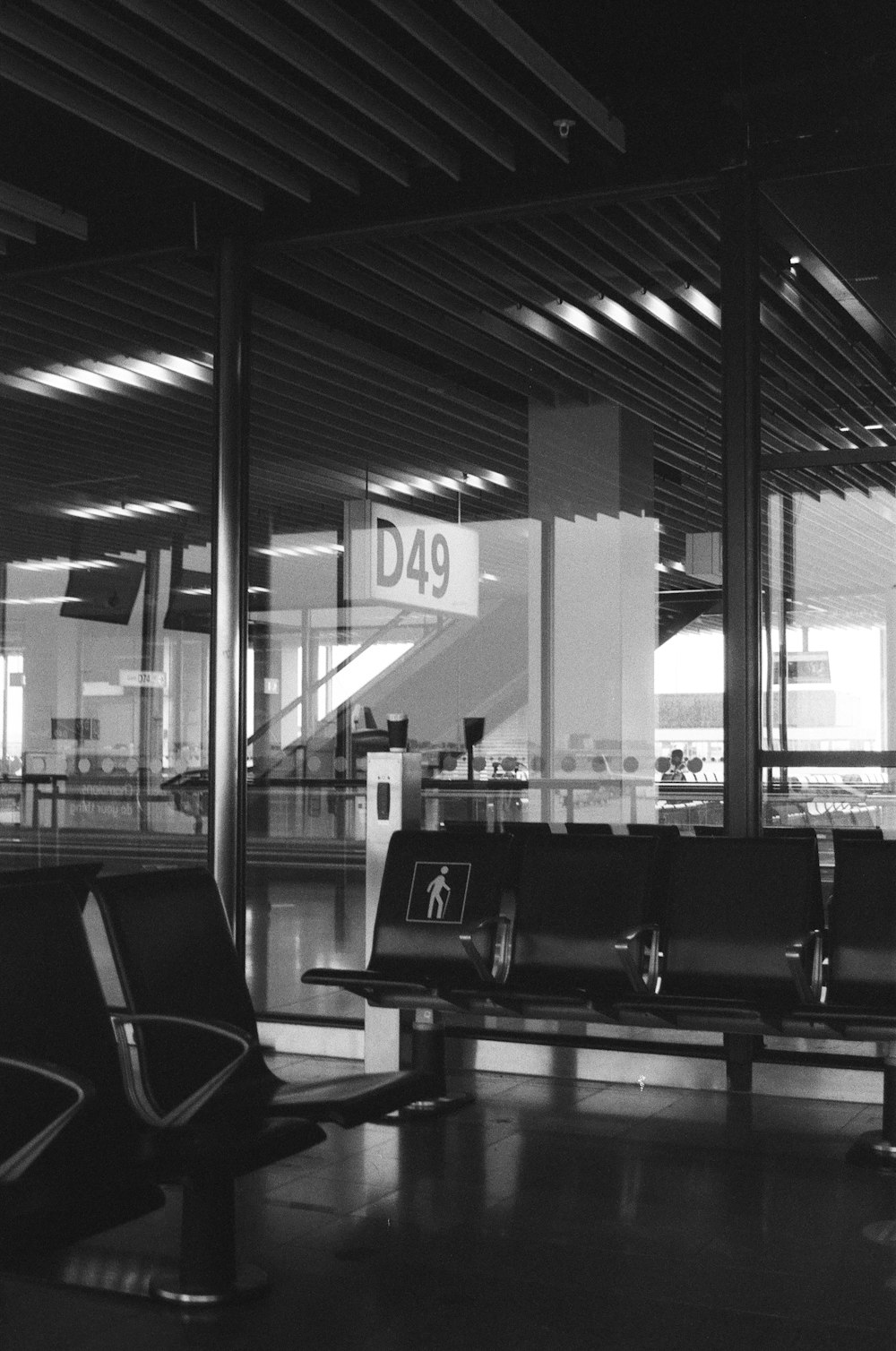 a black and white photo of a waiting area