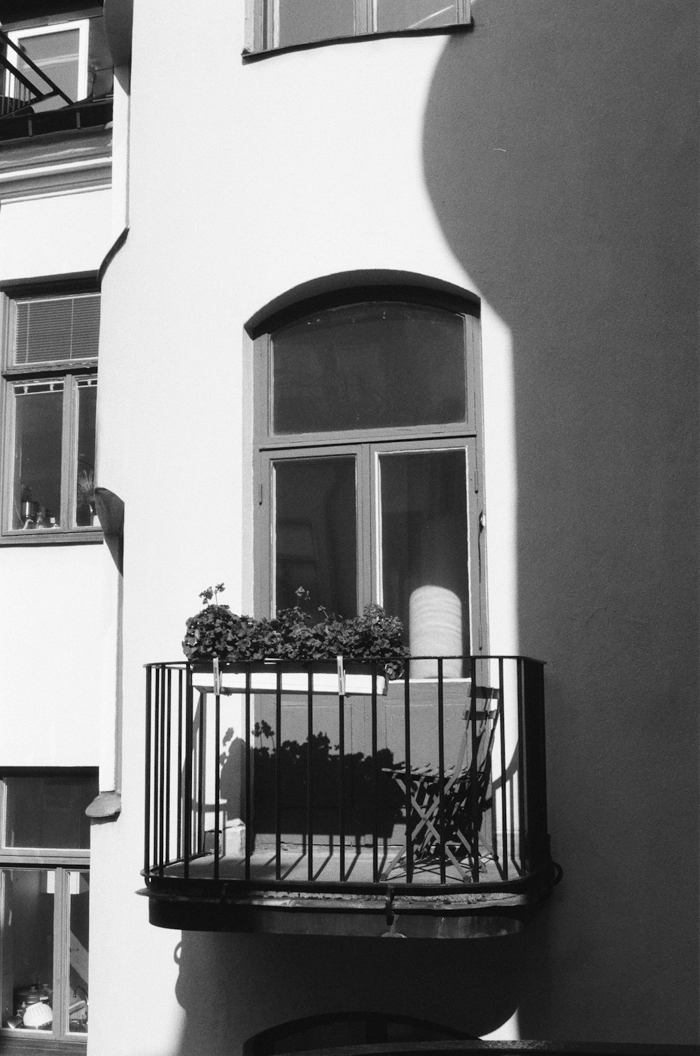 black metal fence near white concrete building