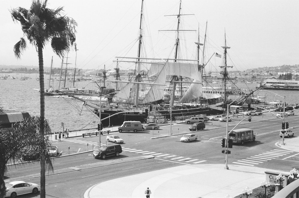 grayscale photo of cars on road