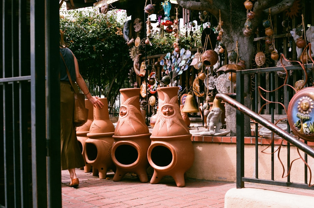 brown clay pots on gray metal railings