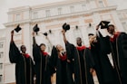 group of people wearing black academic dress
