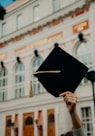 person holding black academic hat