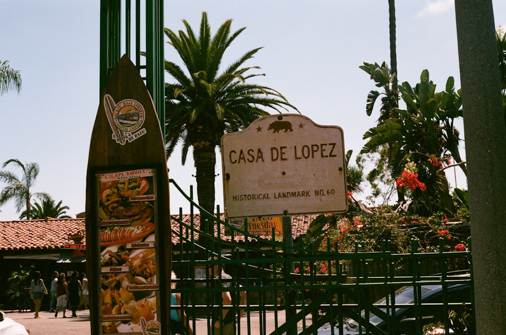 black metal fence with signage