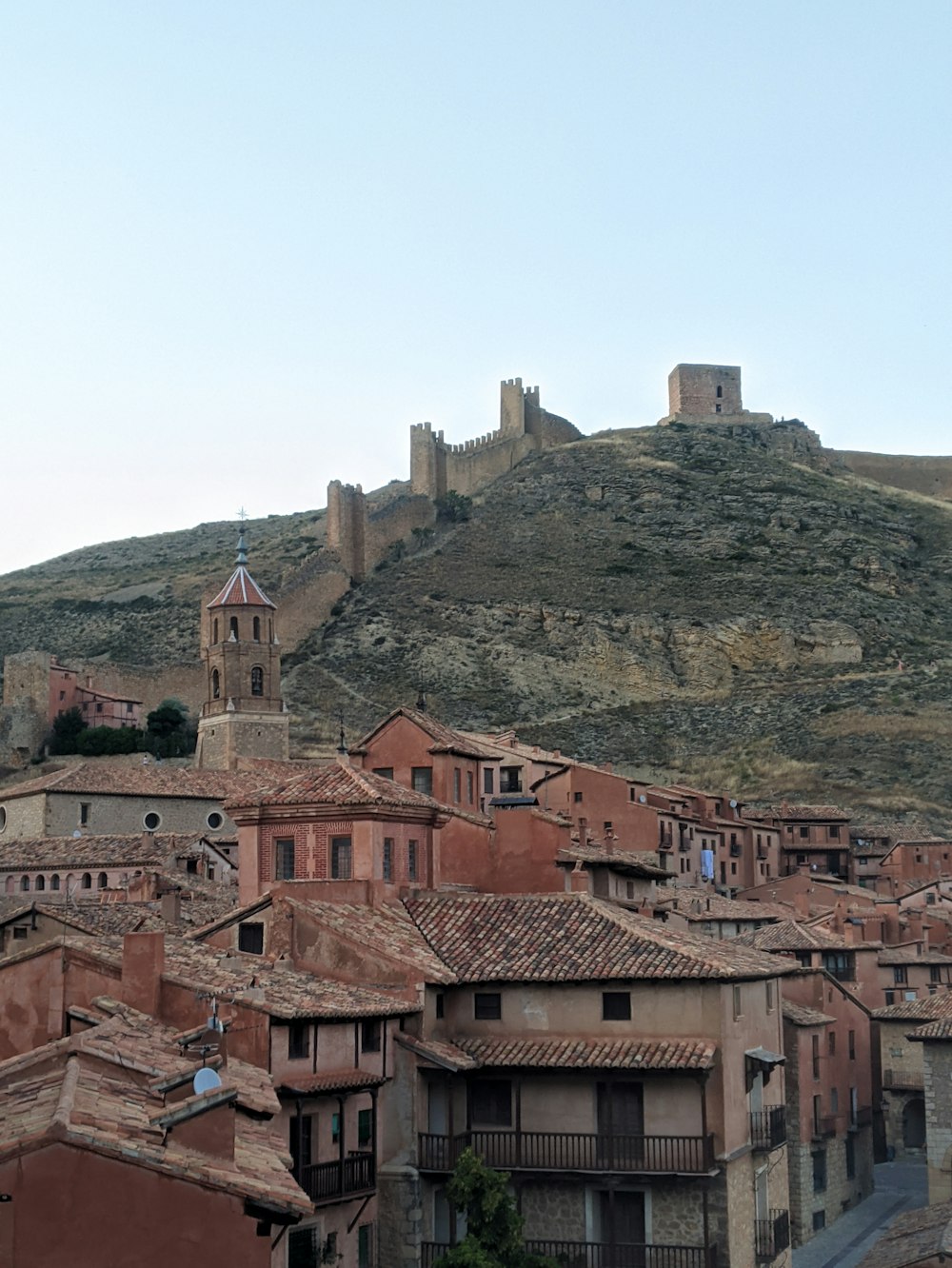 brown concrete houses on mountain