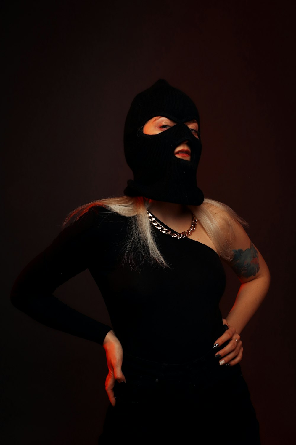 woman in black tank top wearing black mask