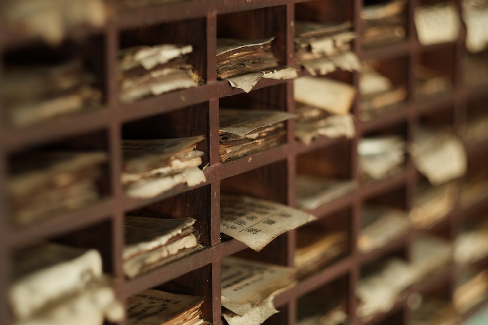 brown wooden shelf with brown cardboard boxes