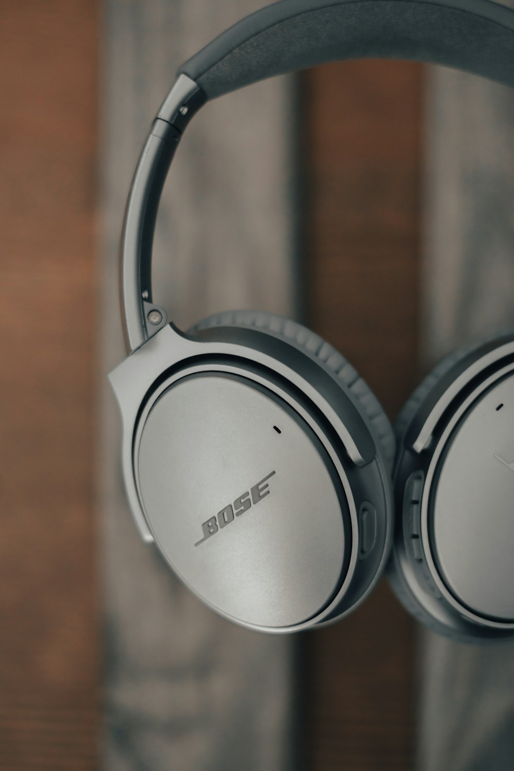 white sony headphones on brown wooden table