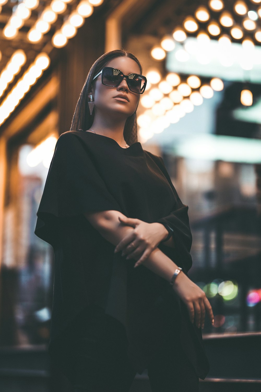 woman in black long sleeve shirt wearing black sunglasses