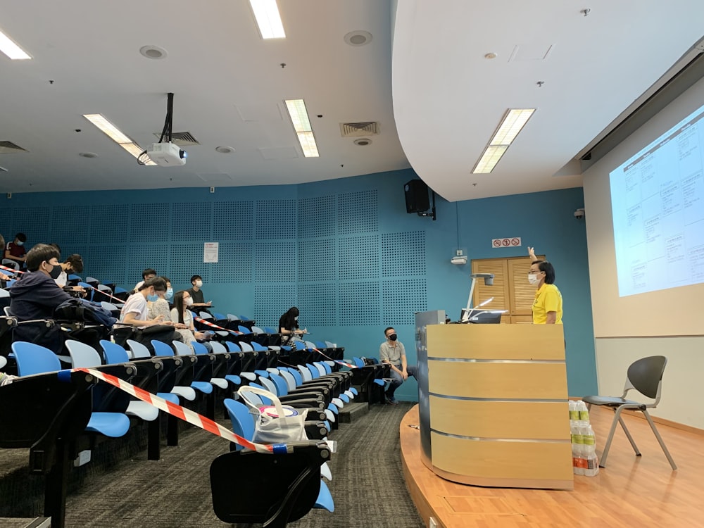 people sitting on chairs inside room