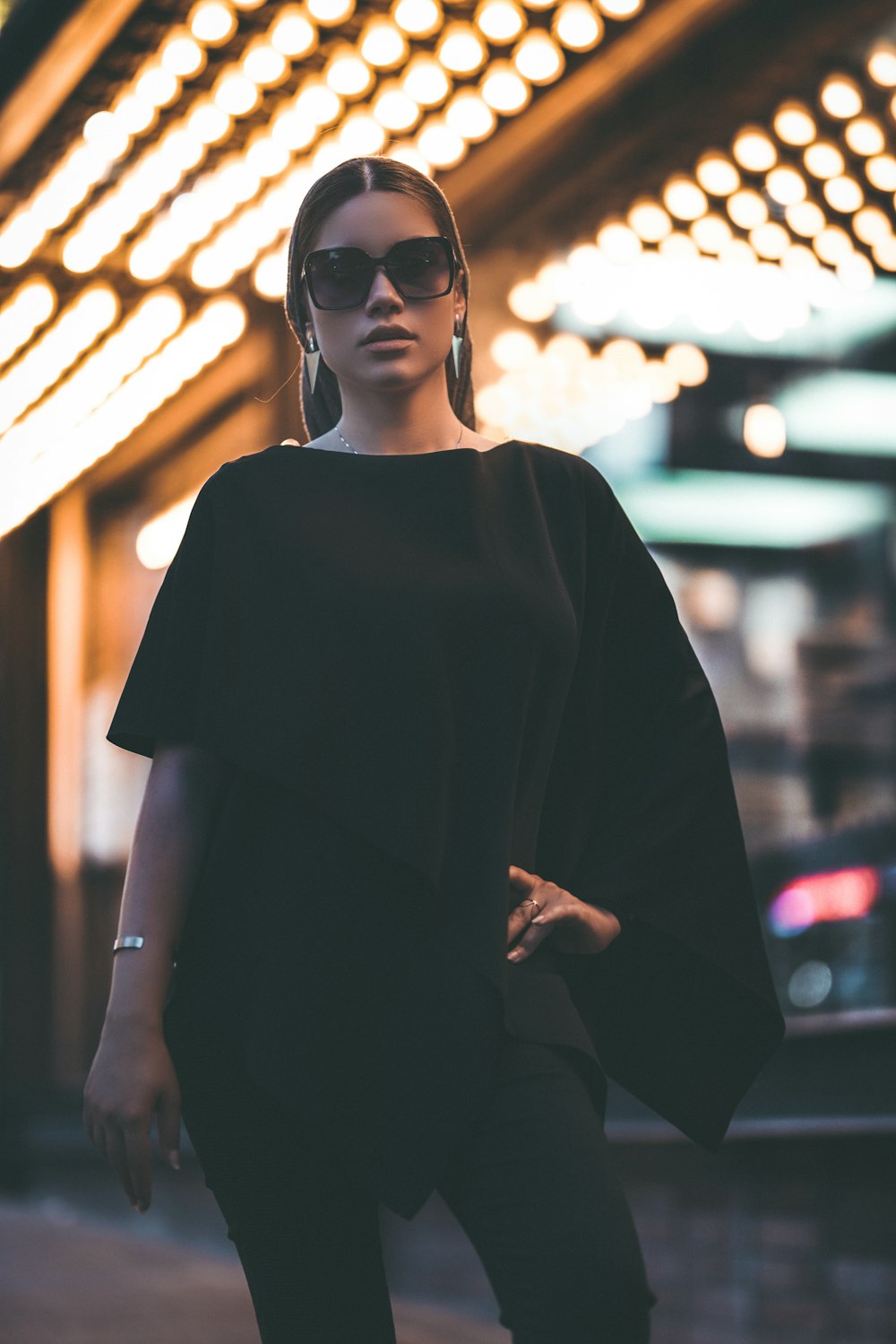 woman in black crew neck t-shirt wearing black sunglasses