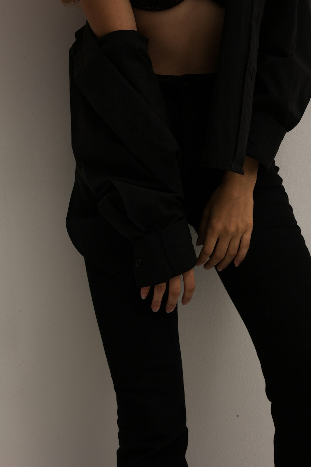 person in black long sleeve shirt and black pants