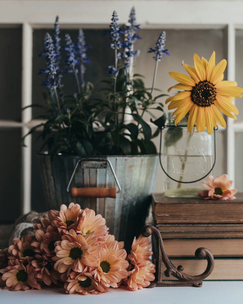 orange flowers in clear glass vase