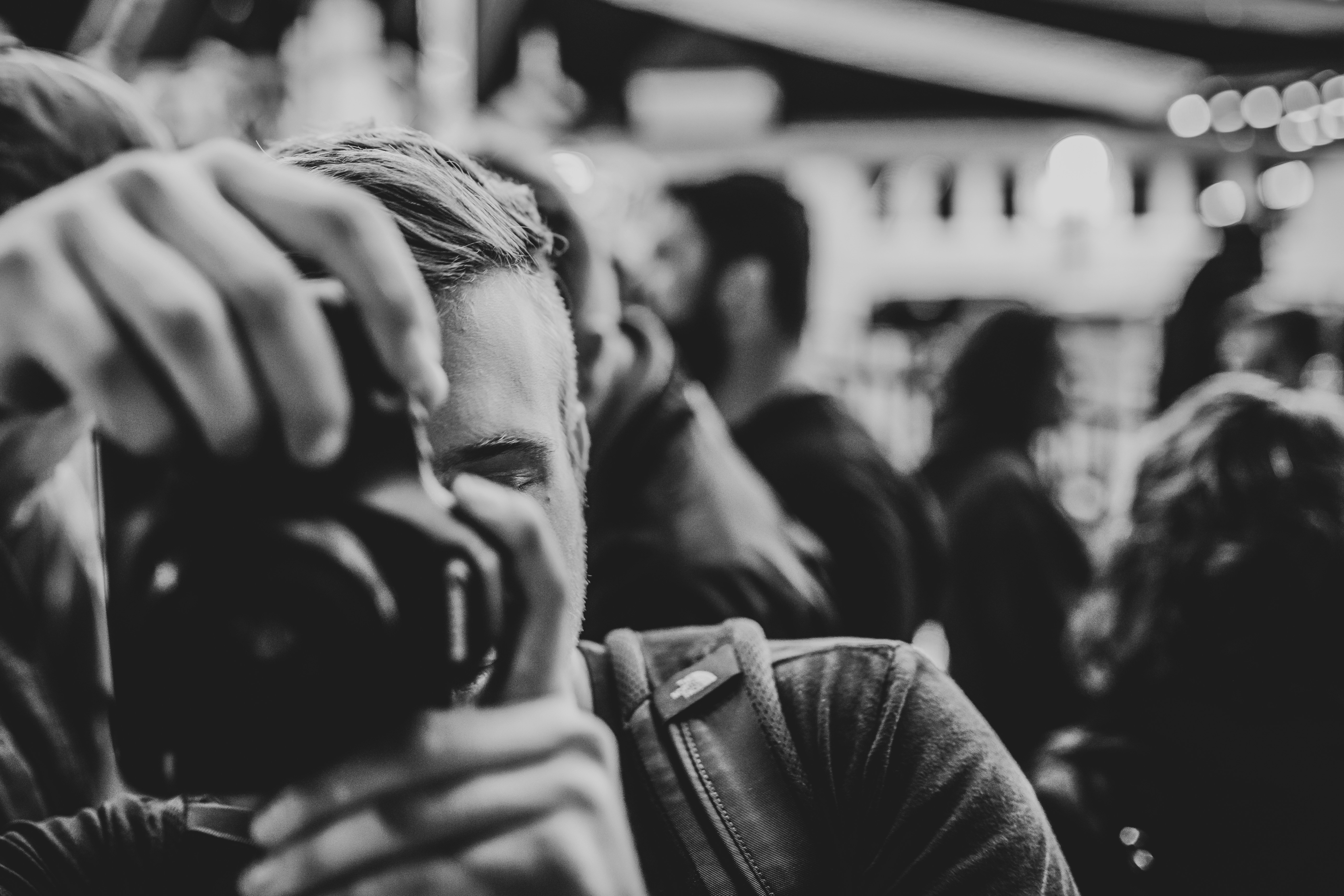 grayscale photo of man in black leather jacket