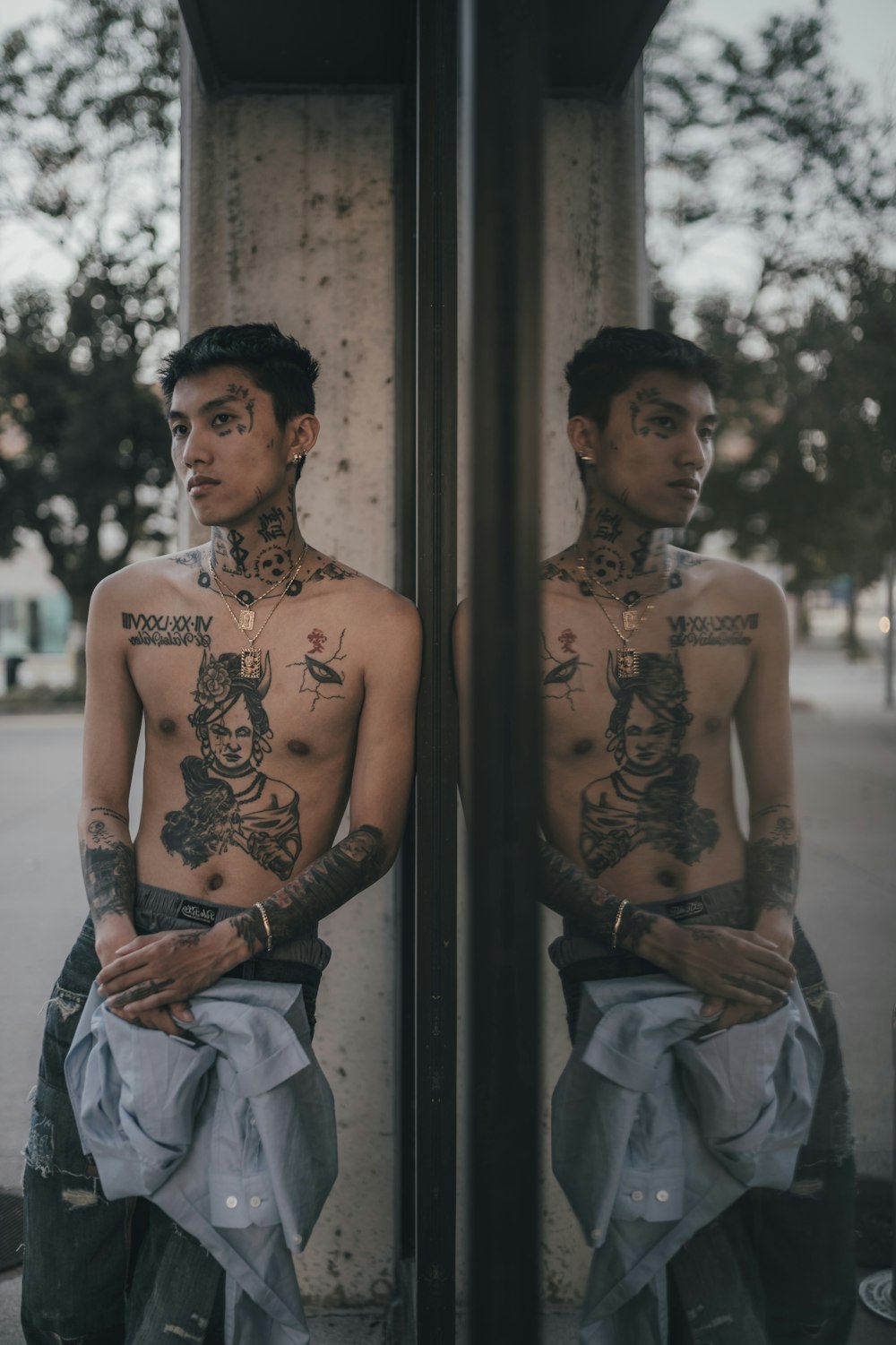 man in black tank top with tattoo on shoulder