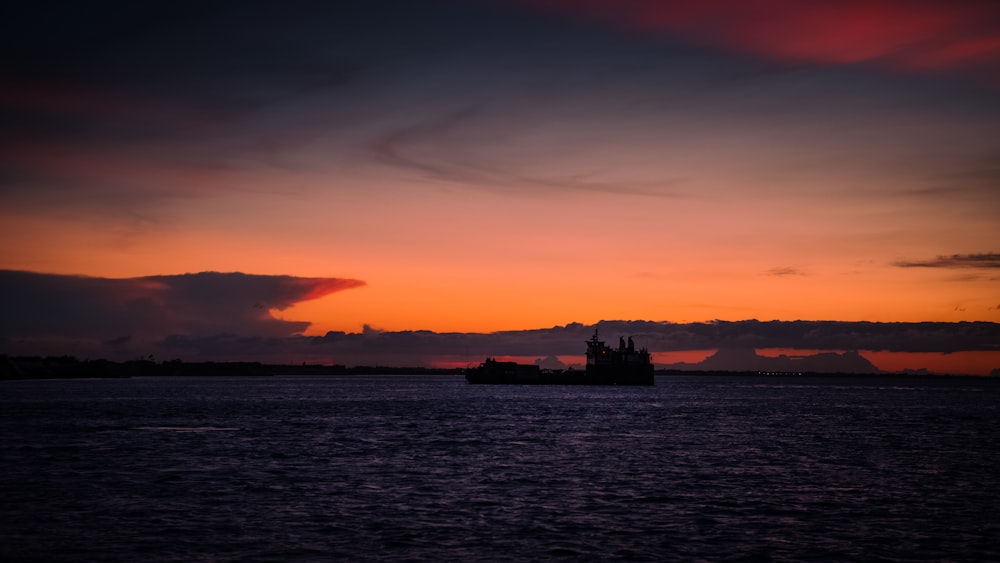 silhouette of building during sunset