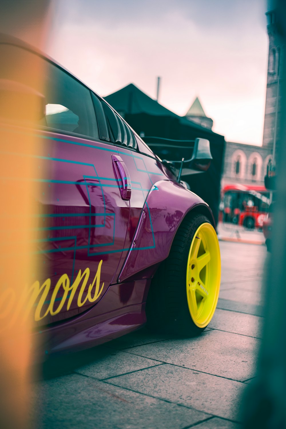 purple and yellow car on road