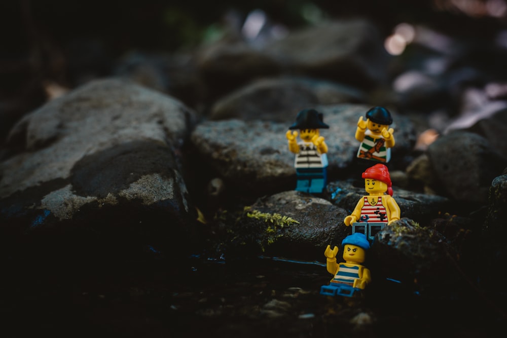 lego minifig on black rock