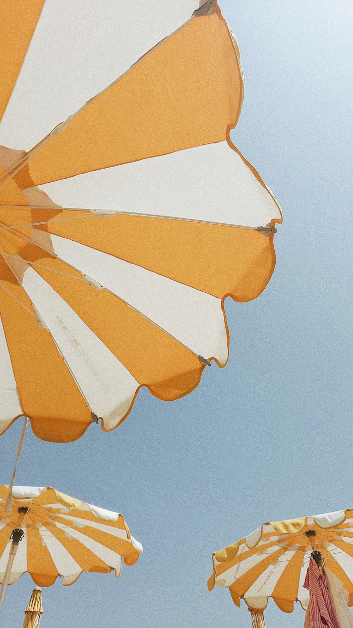 Beach umbrella against a blue sky — representative category image