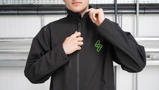man in black nike hoodie standing near window