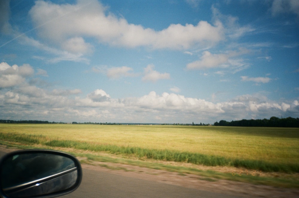 green grass field under blue sky during daytime