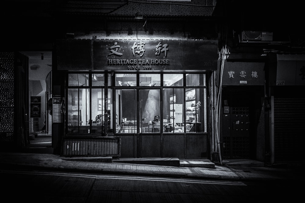 grayscale photo of store front