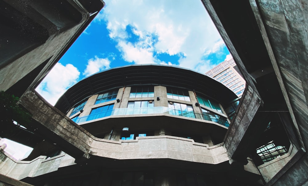 gray and brown concrete building under blue sky during daytime