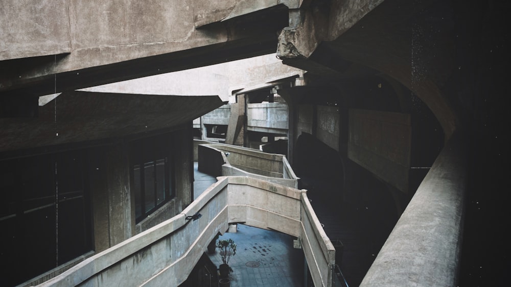 blue swimming pool beside brown concrete building during daytime