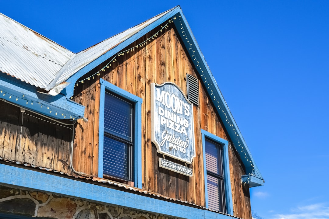 brown wooden house under blue sky during daytime