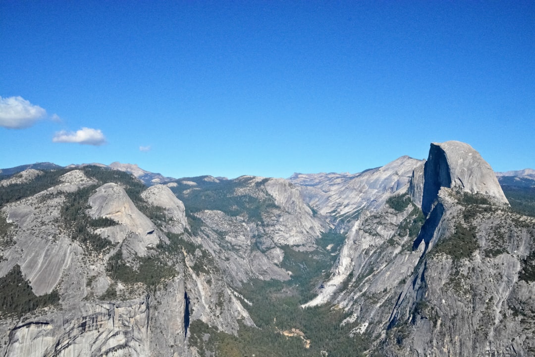 gray rocky mountain under blue sky during daytime