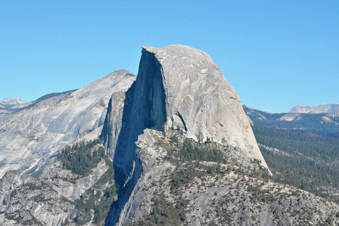 gray rocky mountain under blue sky during daytime