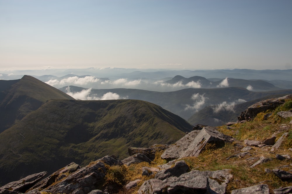 green and brown mountains under white clouds during daytime