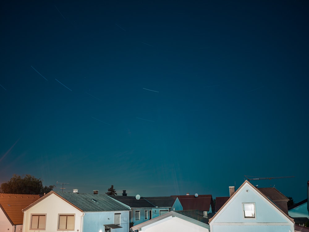 white and brown houses under blue sky