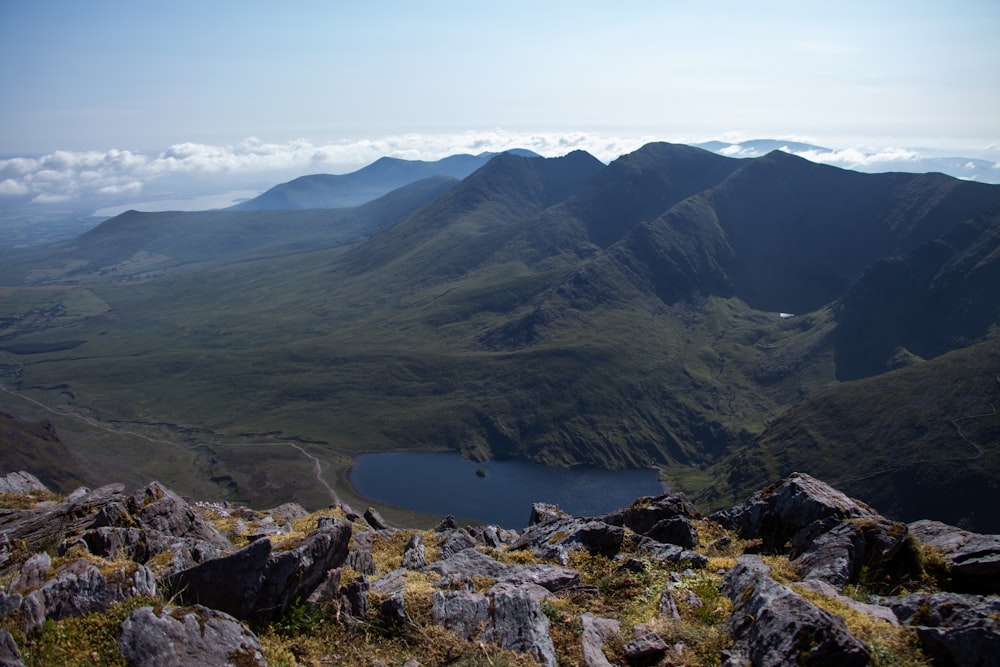 green mountains near body of water during daytime