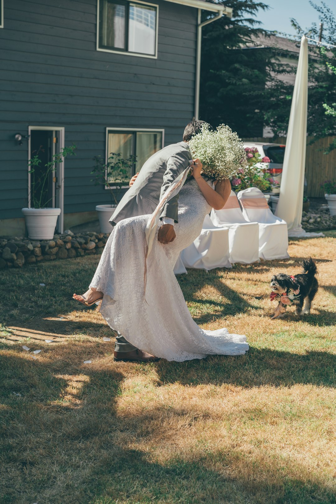 woman in white wedding dress standing on green grass field during daytime