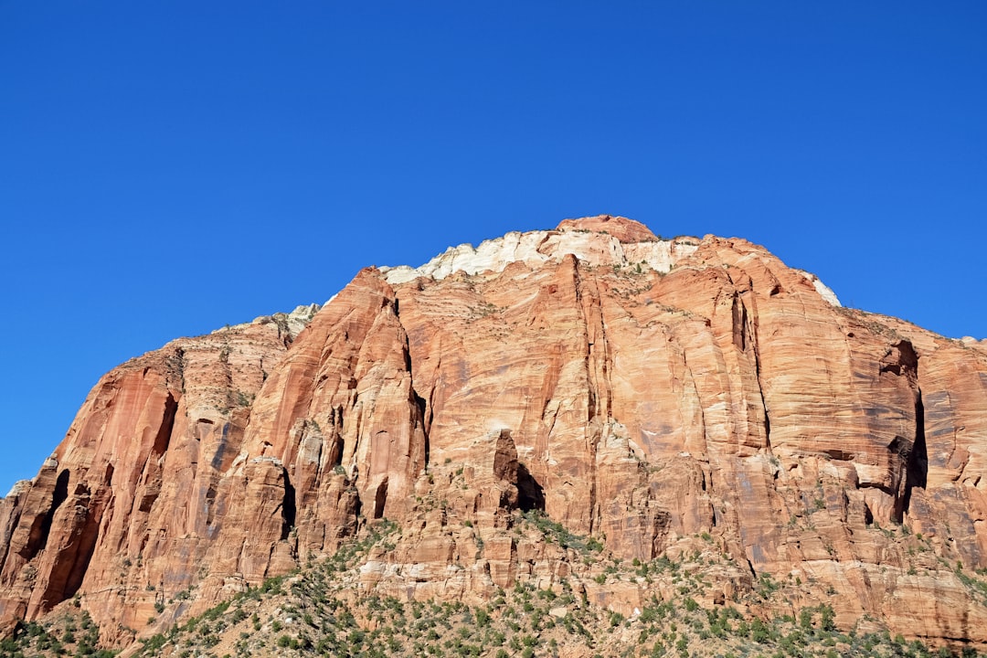 brown rock formation under blue sky during daytime