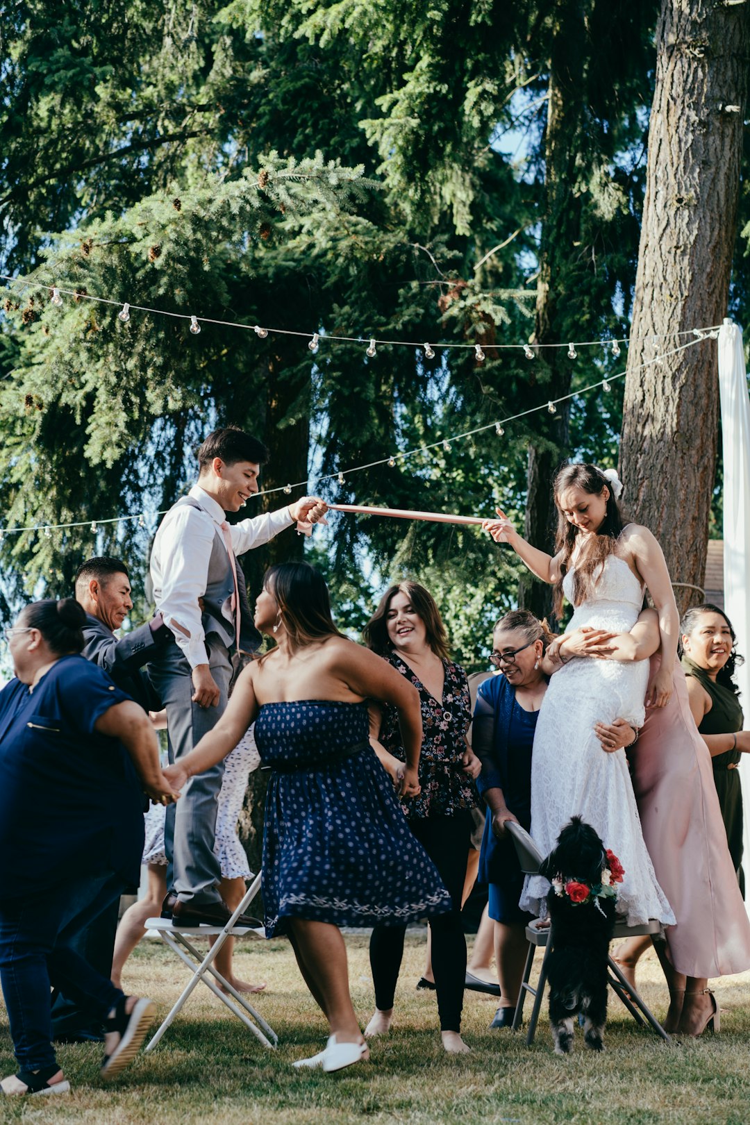 group of people standing near green trees during daytime