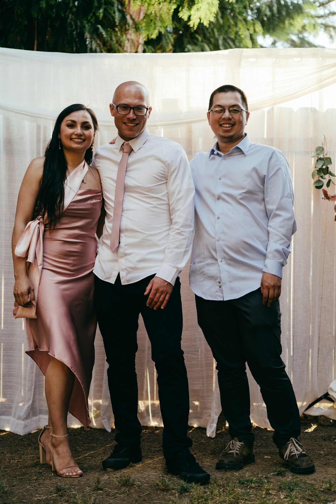 man in white dress shirt beside woman in brown dress